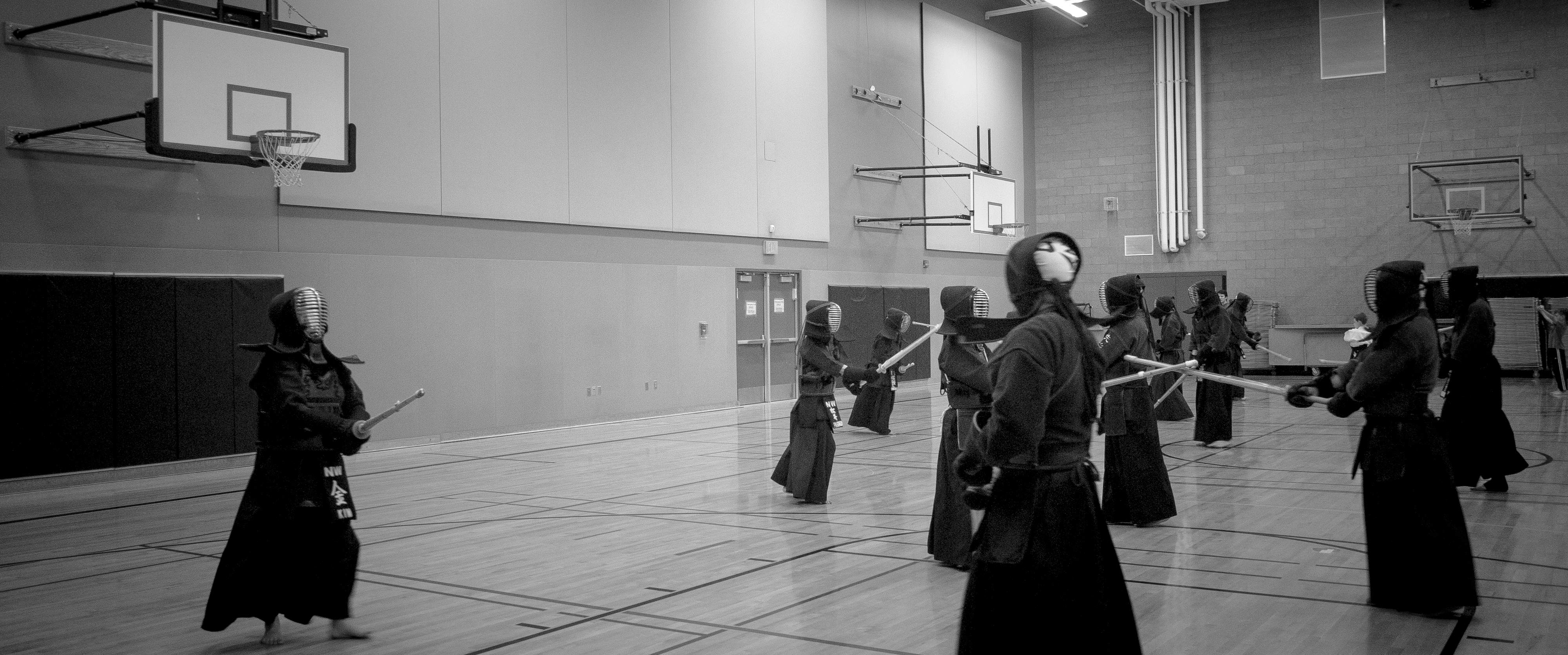 Kendo practice captured from the sidelines inside the dojo space