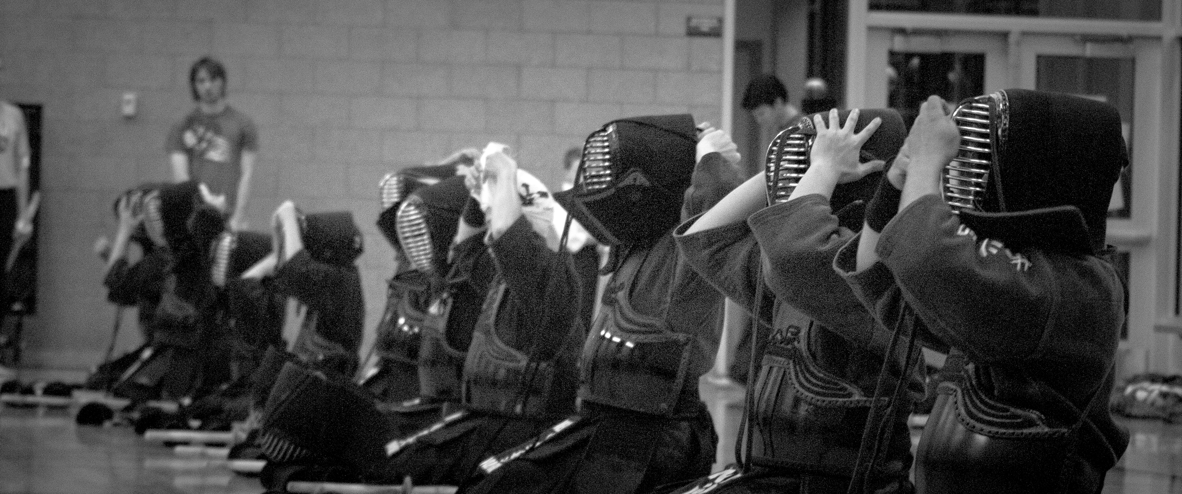 Dojo members lined up on the floor before or after training